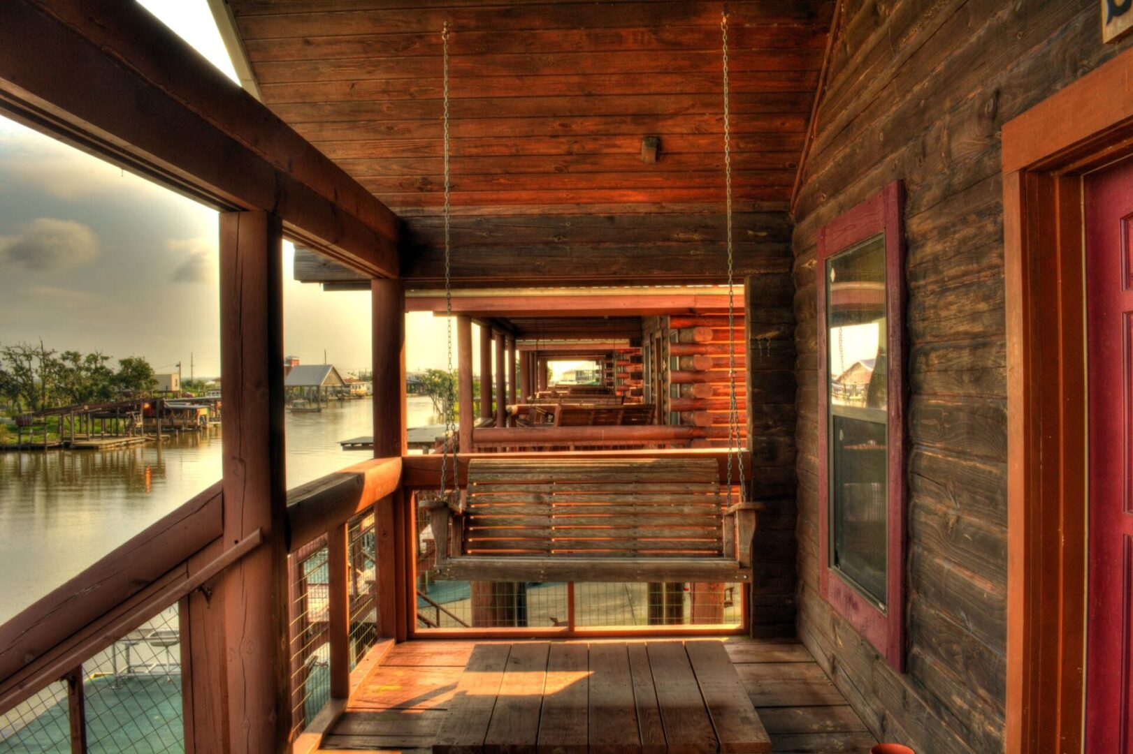 A porch with wooden floors and walls.